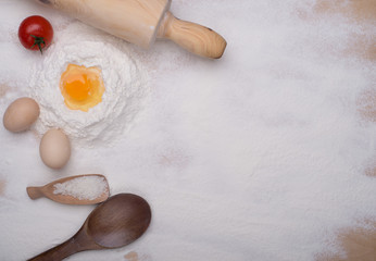 baking ingredients eggs, flour, sugar, butter, yeast. dough preparation. food background