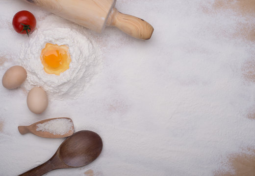 baking ingredients eggs, flour, sugar, butter, yeast. dough preparation. food background