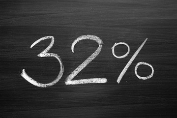 32 percent header written with a chalk on the blackboard