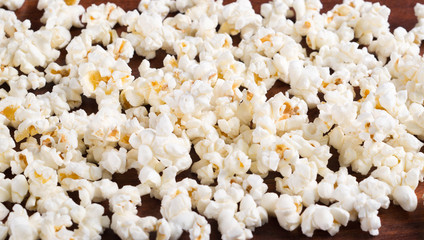 Closeup pile of white fluffy popcorn lying mixed together