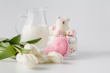 cup of tea with tulips on a white background