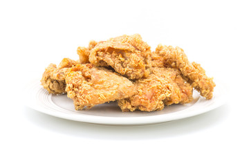 Fried chicken in white plate on white table, on isolate