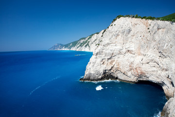 Beautiful landscape of wild island cliffs over a deep blue sea. 