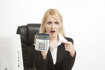 Attractive blonde female accountant with calculator 