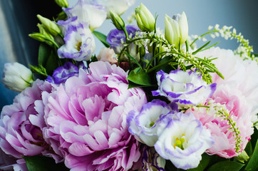 Naklejka na ściany i meble Rich bunch of pink peonies peony and lilac eustoma roses flowers. Rustic style, still life. Fresh spring bouquet, pastel colors. Background.