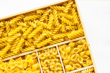 Several kinds of of pasta in a wooden box