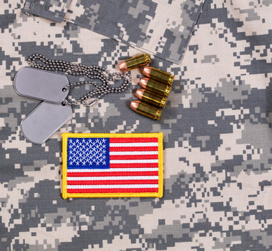 USA flag patch, ID tags, bullets on military uniform