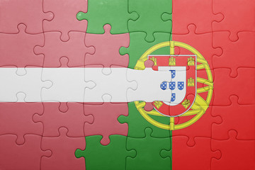 puzzle with the national flag of portugal and latvia
