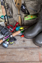 fishing tackles with fishing vest and boots