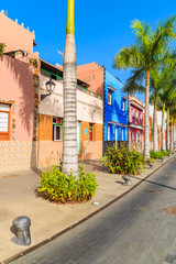 Colourful houses and palm trees on street in Puerto de la Cruz town, Tenerife, Canary Islands, Spain