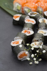 Sushi set over black background