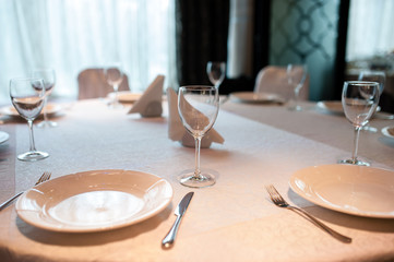 Empty plate, glasses and silverware set