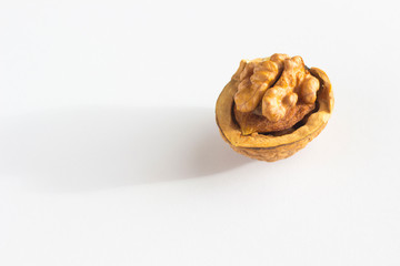 Half a walnut on a white background