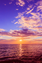 Beautiful Sunset on the beach with dramatic orange and dark shade of blue sky in the evening