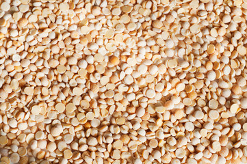 The texture of gold coarse dry peas horizontal