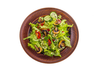 vegetable salad - cold appetizer of fried mushrooms with lettuce and tomatoes