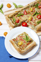 Pie with cheese, tomatoes, herbs and spices
