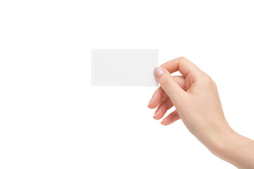 Fototapeta premium Isolated female hand holds white card on a white background.