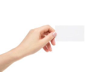 Female hand holds white card on a white background.