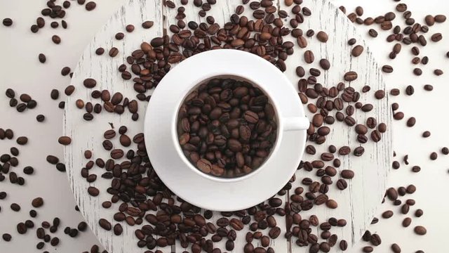 Morning coffee. Coffee magic. Roasted coffee beans turn into fragrant drink.