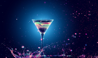 Colourful cocktail in glass with splash