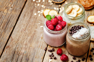 set overnight oats with berries, coconut, peanut butter, Chia se