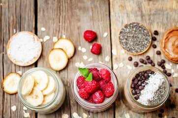 set overnight oats with berries, coconut, peanut butter, Chia se
