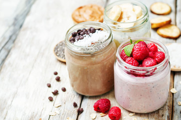 set overnight oats with berries, coconut, peanut butter, Chia se