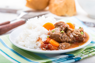 Beef and vegetable casserole served with rice