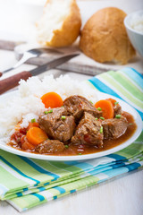 Beef and vegetable casserole served with rice