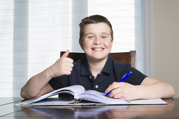 boy doing his homework at home