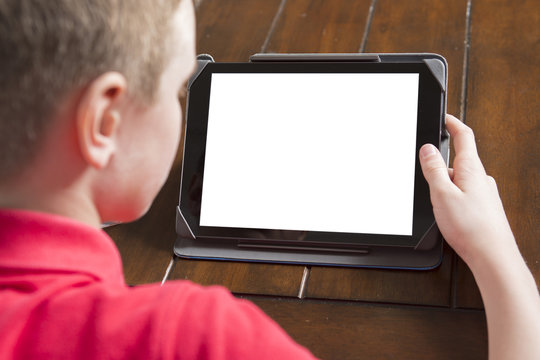 Child holding white tablet PC in hands