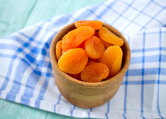 dried apricots on wooden table