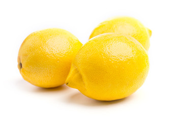 Whole fresh lemons on on white, DOF
