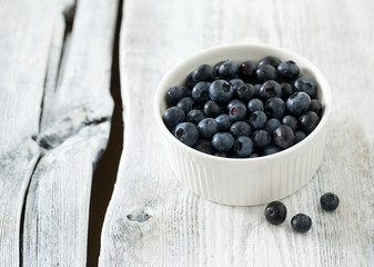 blueberry on wooden surface