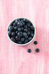 blueberry on wooden surface
