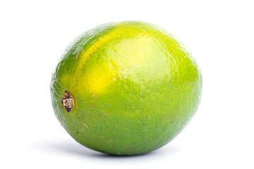 Whole fresh lime on on white, DOF