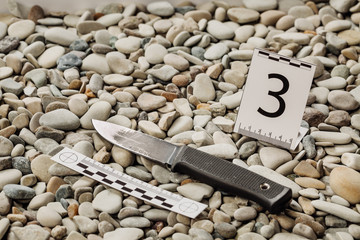Crime scene investigation. knife dragged along outdoors