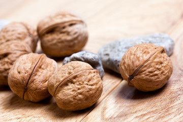 Walnuts on rustic wooden board