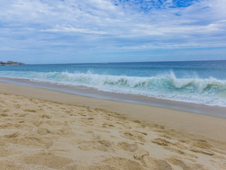 View of Waves at Sandy Beach of Cabo San Lucas in Mexico