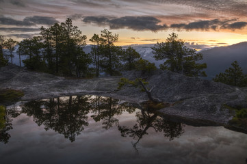 Reflection of a lake on top of the mountain during sunrise!