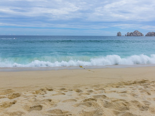 View of Waves at Sandy Beach of Cabo San Lucas in Mexico