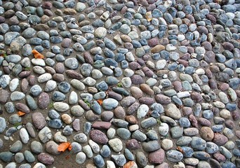 Closeup of old street gravel pavement texture