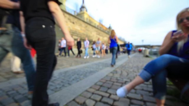 Prague riverside, popular during summer for its bars and chilled atmosphere. People walking in blurry/out of focus footage