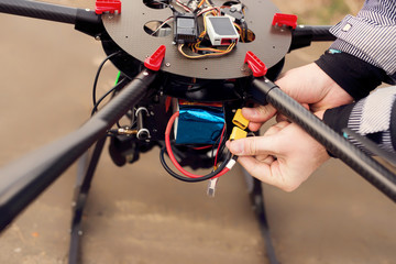 Connecting a battery on a drone.