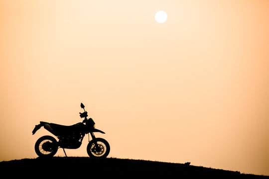 motorcycle with sunset background