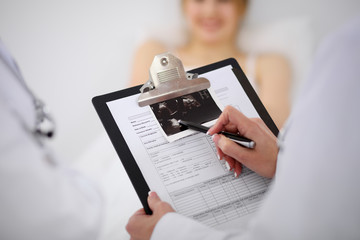 Fototapeta premium Two doctors discussing a patient ultrasound