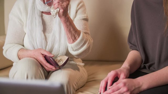 Elderly person put eyesight glasses in etui case