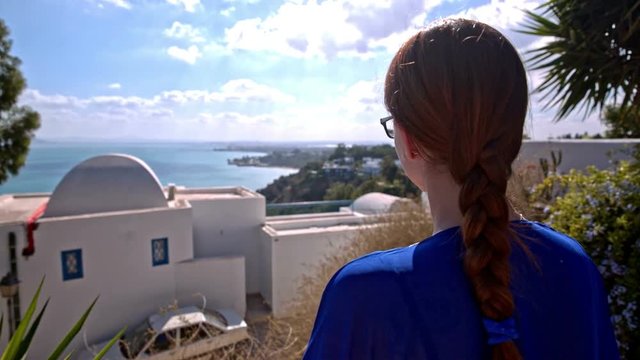 Person observing view in Sidi Bou Said