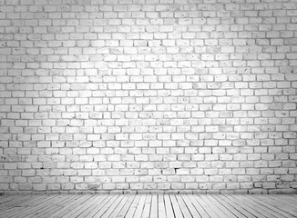 White brick wall and wooden floor